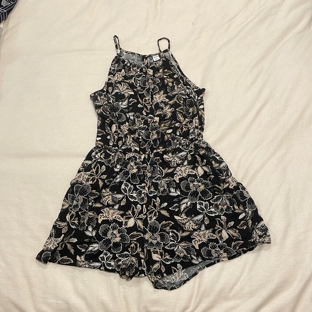 Romper with a flower pattern in size small